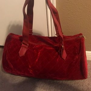 Red velvet duffel bag